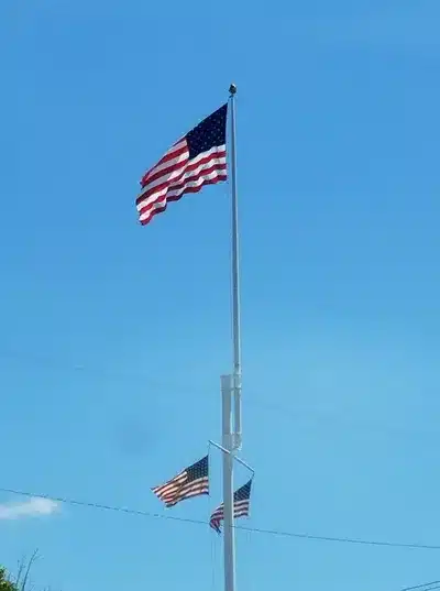 usa flag Close view of Mystic CT Liberty Pole historic flagpole and surrounding park